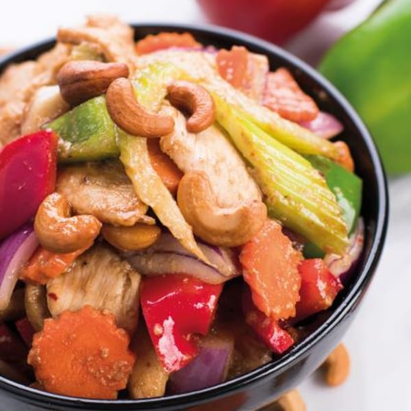 Noi Thai Cuisine's cashew chicken with red and green bell peppers, carrots, and onions.